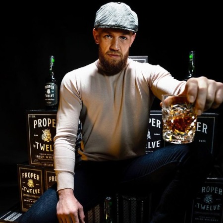 Conor McGregor poses for his former Whiskey Company ad.